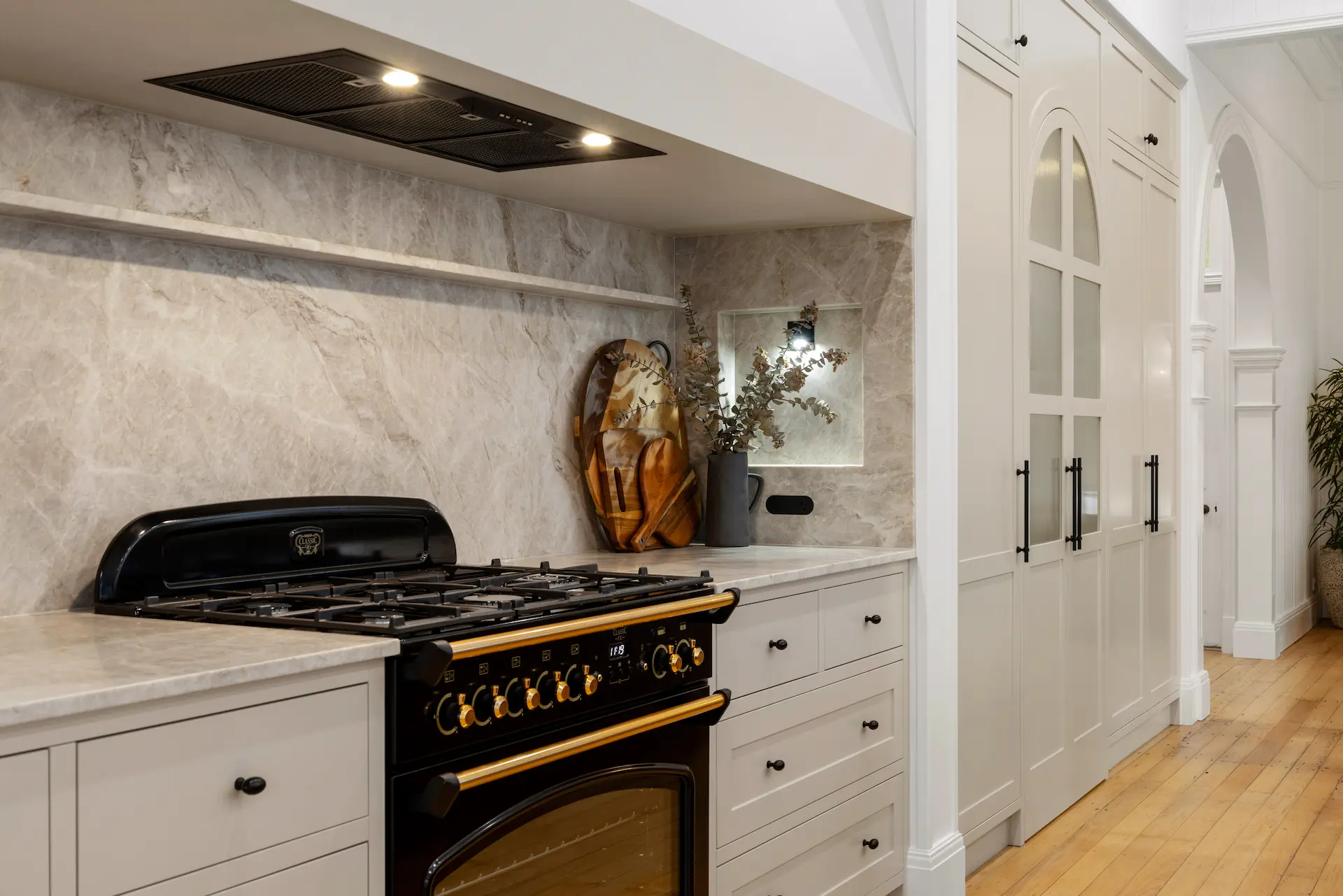 Modern kitchen renovation with timber cabinetry and island bench by Weston Kitchens & Bathrooms