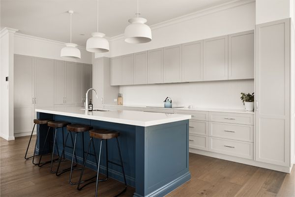 Bright open-concept kitchen featuring contrasting light and dark cabinetry.